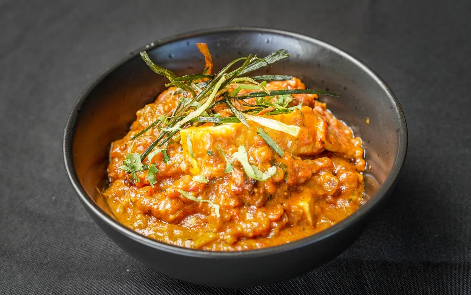 Paneer butter masala in a copper bowl at Indian Culture, Hobart
