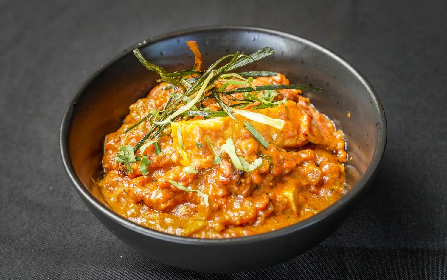 Paneer butter masala in a copper bowl at Indian Culture, Hobart